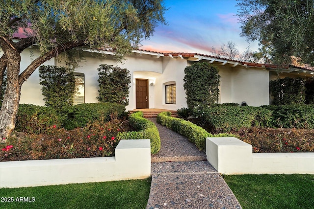 84 Biltmore Est, Phoenix, AZ 85016 - mediterranean / spanish-style home with a tiled roof and stucco siding