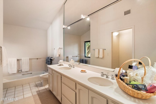 84 Biltmore Est, Phoenix, AZ 85016 - bathroom with a bathing tub, visible vents, vaulted ceiling, and a sink