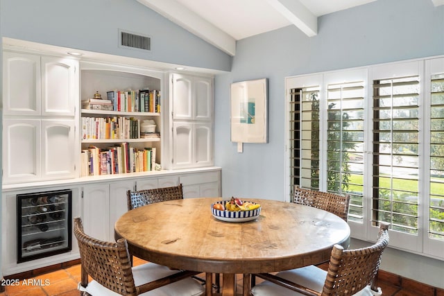 84 Biltmore Est, Phoenix, AZ 85016 - dining area with visible vents, beverage cooler, lofted ceiling with beams, and light tile patterned floors