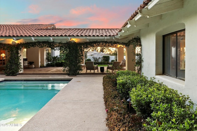 84 Biltmore Est, Phoenix, AZ 85016 - pool at dusk featuring an outdoor pool and a patio area