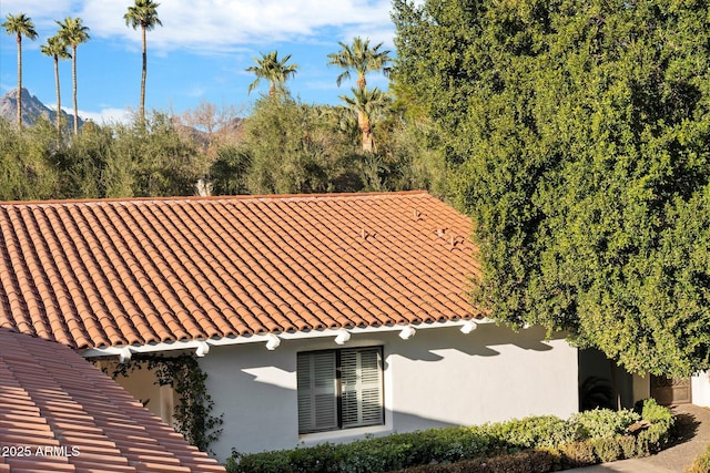 84 Biltmore Est, Phoenix, AZ 85016 - view of home's exterior featuring a tiled roof and stucco siding