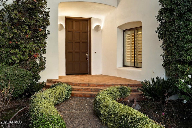 84 Biltmore Est, Phoenix, AZ 85016 - doorway to property featuring stucco siding
