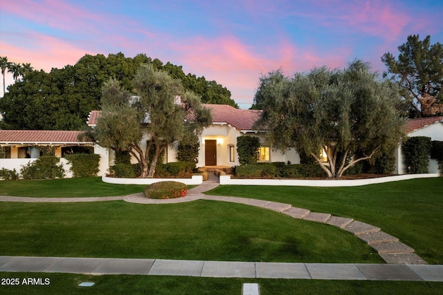 84 Biltmore Est, Phoenix, AZ 85016 - view of front of property with a front yard, a tiled roof, and stucco siding