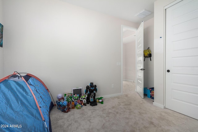 carpeted bedroom featuring visible vents and baseboards