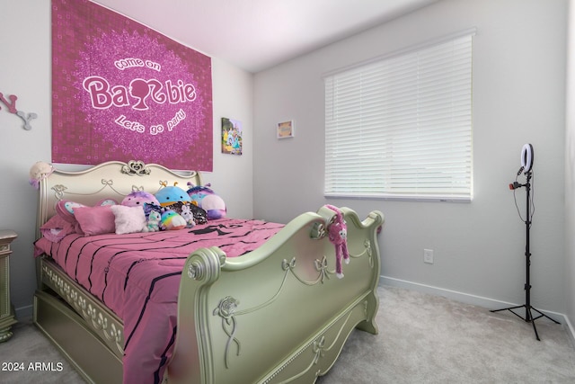 bedroom featuring baseboards and carpet flooring