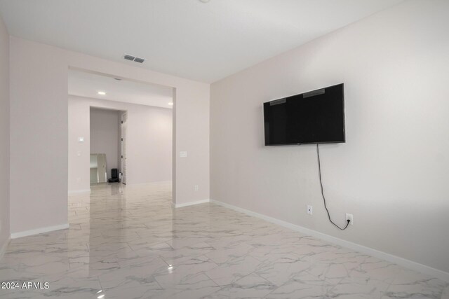 interior space featuring marble finish floor, recessed lighting, visible vents, and baseboards