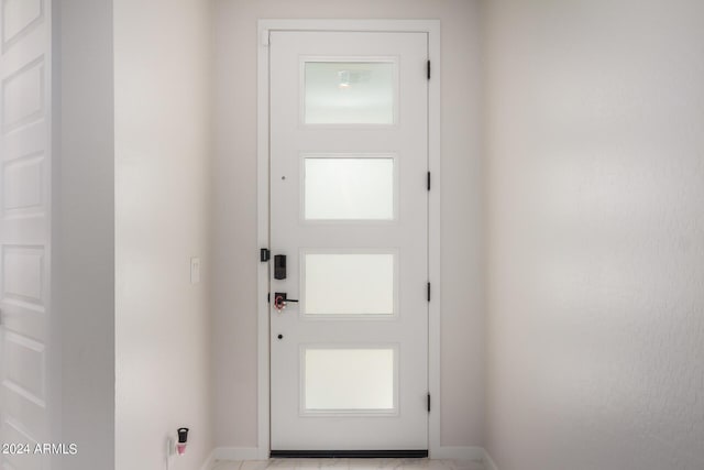 entryway featuring baseboards