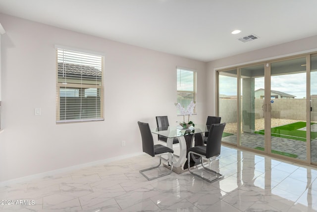 dining space with marble finish floor, recessed lighting, visible vents, and baseboards