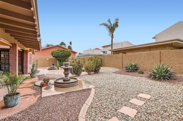 view of yard with a patio area and a fenced backyard