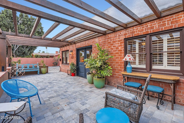 view of patio / terrace with fence and a pergola