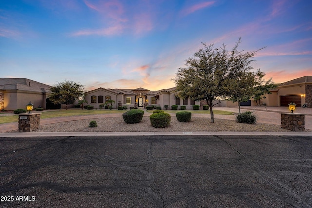 26204 S Washington St, Chandler, AZ 85249 - mediterranean / spanish-style house featuring curved driveway and stucco siding