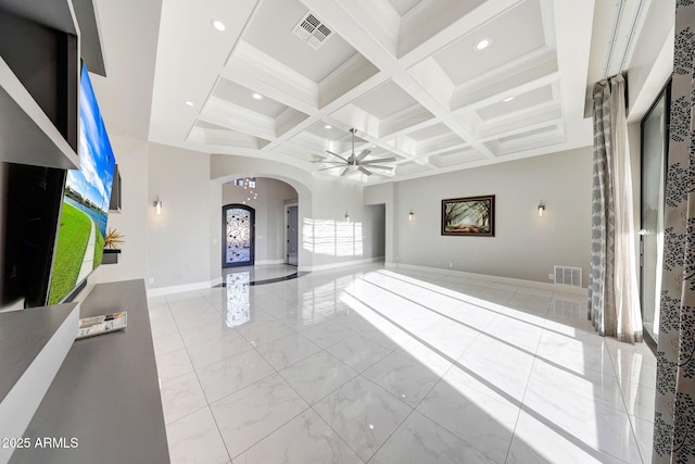 26204 S Washington St, Chandler, AZ 85249 - unfurnished living room with arched walkways, coffered ceiling, a ceiling fan, beam ceiling, and marble finish flooring