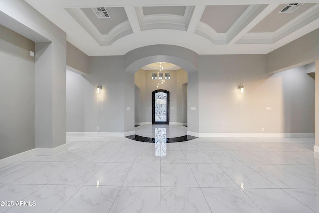 26204 S Washington St, Chandler, AZ 85249 - empty room featuring marble finish flooring, arched walkways, and coffered ceiling