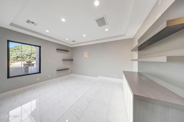 26204 S Washington St, Chandler, AZ 85249 - unfurnished room with a tray ceiling, recessed lighting, and light marble finish floors