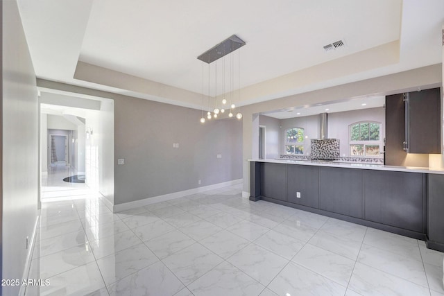 26204 S Washington St, Chandler, AZ 85249 - spare room featuring a tray ceiling, light marble finish flooring, and recessed lighting
