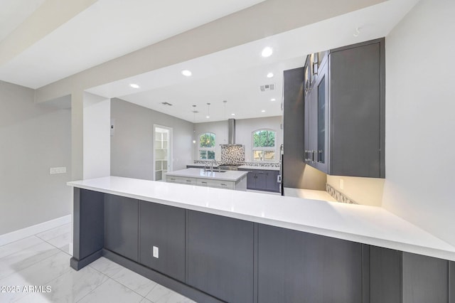 26204 S Washington St, Chandler, AZ 85249 - kitchen with light marble finish flooring, light countertops, a spacious island, a peninsula, and recessed lighting