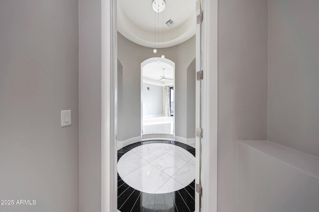 26204 S Washington St, Chandler, AZ 85249 - hallway with arched walkways, inlaid floor details, and tile patterned floors