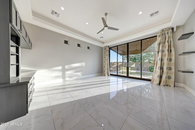 26204 S Washington St, Chandler, AZ 85249 - spare room featuring a ceiling fan, a raised ceiling, light marble finish floors, and recessed lighting