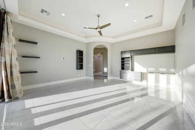 26204 S Washington St, Chandler, AZ 85249 - unfurnished room with a tray ceiling, arched walkways, a ceiling fan, and recessed lighting
