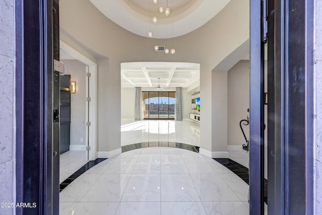 26204 S Washington St, Chandler, AZ 85249 - entrance foyer featuring coffered ceiling, marble tiled floors, and beamed ceiling