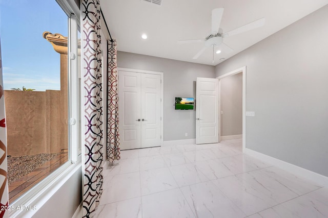 26204 S Washington St, Chandler, AZ 85249 - unfurnished bedroom with light marble finish floors, ceiling fan, recessed lighting, and a closet