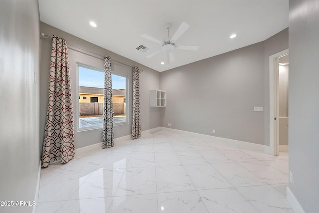 26204 S Washington St, Chandler, AZ 85249 - unfurnished room with a ceiling fan, recessed lighting, and marble finish floors