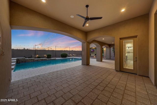 26204 S Washington St, Chandler, AZ 85249 - pool at dusk featuring a patio and ceiling fan