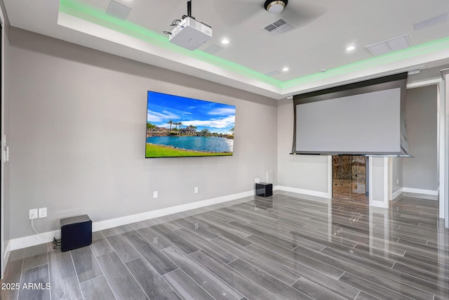 26204 S Washington St, Chandler, AZ 85249 - home theater room with a raised ceiling, wood finished floors, and recessed lighting