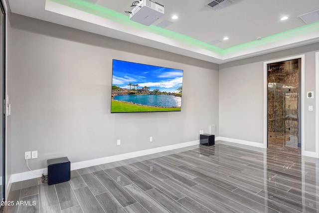 26204 S Washington St, Chandler, AZ 85249 - spare room featuring a raised ceiling, recessed lighting, and wood finished floors