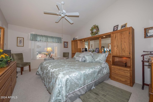 bedroom featuring ceiling fan, light carpet, and lofted ceiling