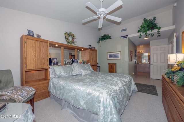 bedroom with ensuite bath and ceiling fan