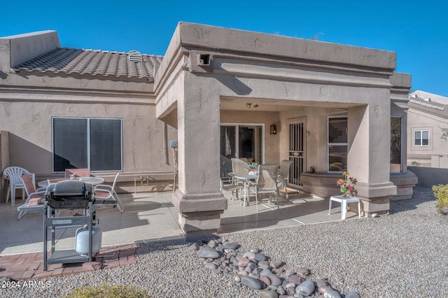 back of house featuring a patio area