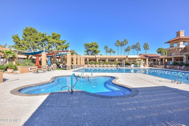 view of swimming pool with a patio area