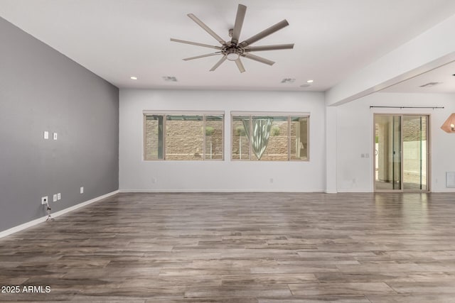 26860 N 102nd Ln, Peoria, AZ 85383 - unfurnished living room with ceiling fan, recessed lighting, baseboards, wood finished floors, and visible vents