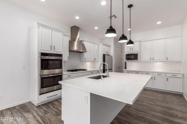 26860 N 102nd Ln, Peoria, AZ 85383 - kitchen featuring wall chimney range hood, white cabinets, stainless steel appliances, and visible vents