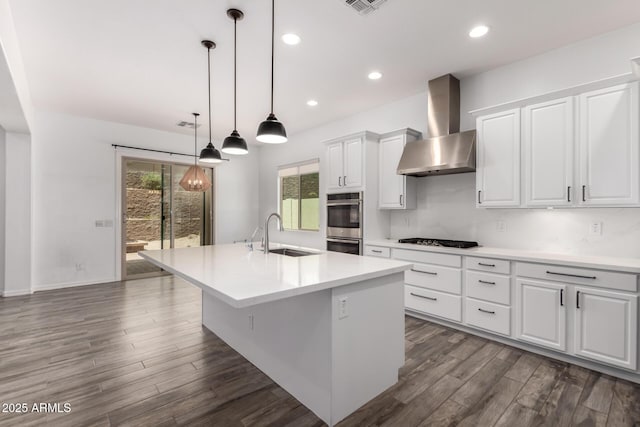 26860 N 102nd Ln, Peoria, AZ 85383 - kitchen with wall chimney range hood, dark wood finished floors, a sink, and double oven