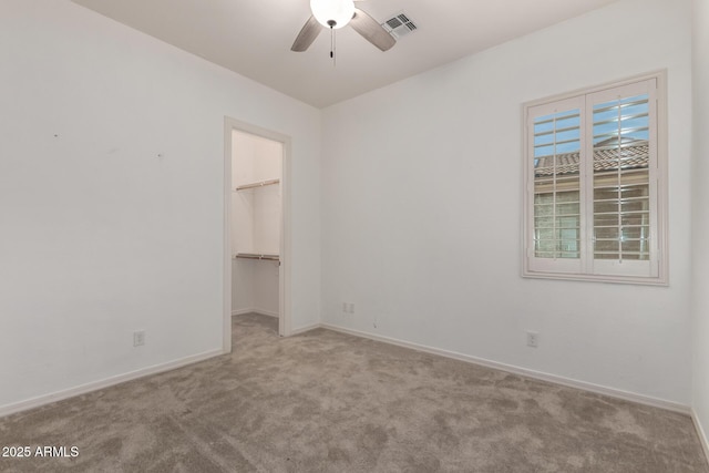 26860 N 102nd Ln, Peoria, AZ 85383 - unfurnished bedroom featuring carpet, baseboards, a spacious closet, visible vents, and a closet