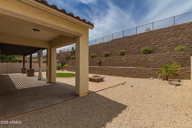 26860 N 102nd Ln, Peoria, AZ 85383 - view of patio featuring fence and an outdoor fire pit