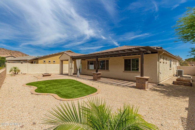 26860 N 102nd Ln, Peoria, AZ 85383 - back of property featuring a patio area, central air condition unit, a fenced backyard, a pergola, and stucco siding