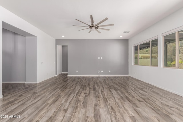 26860 N 102nd Ln, Peoria, AZ 85383 - unfurnished room with visible vents, wood finished floors, baseboards, ceiling fan, and recessed lighting