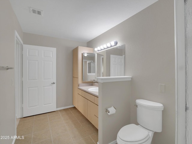 bathroom with tile patterned flooring, visible vents, baseboards, toilet, and vanity