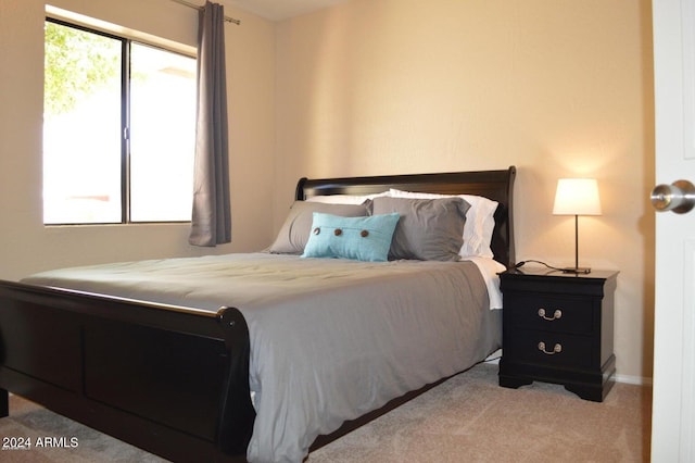 bedroom with light colored carpet