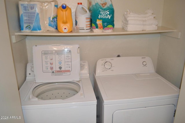 washroom featuring laundry area and independent washer and dryer