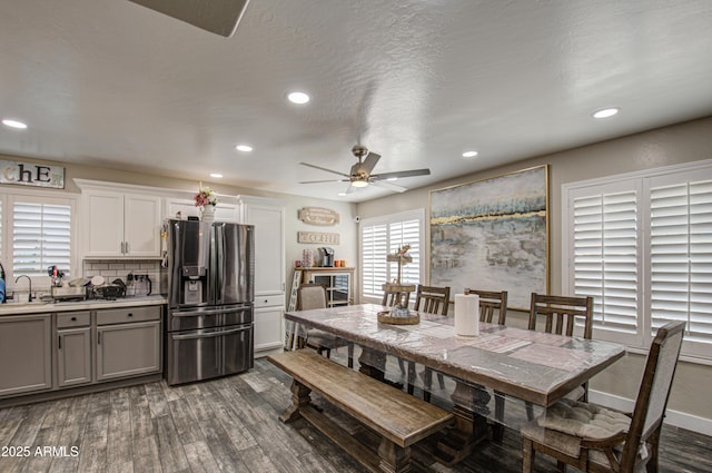 dining area featuring baseboards, dark wood-type flooring, and recessed lighting