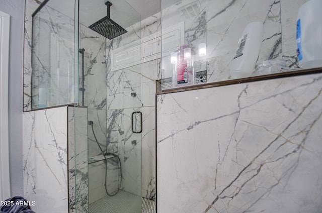 full bathroom with a marble finish shower