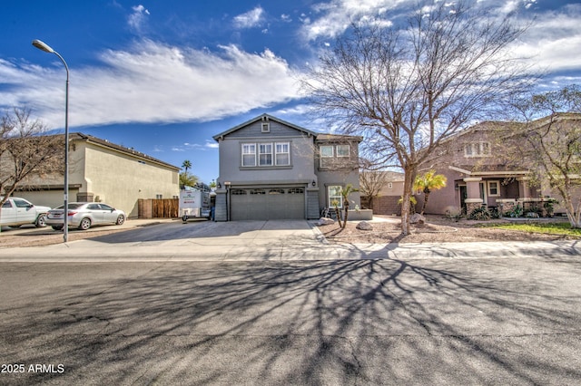 view of front of property featuring a garage, driveway, and stucco siding