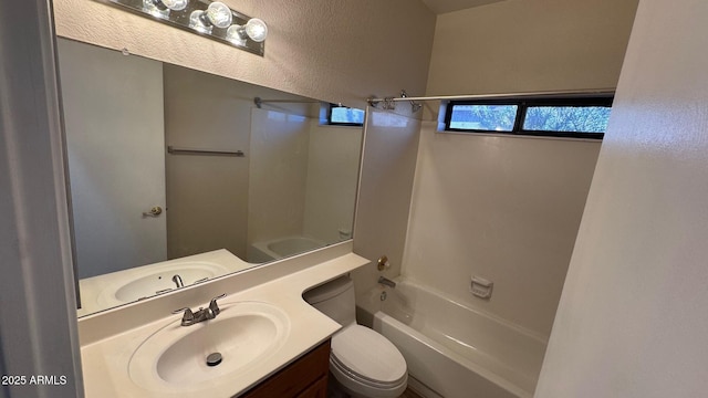 full bathroom featuring toilet, shower / washtub combination, and vanity