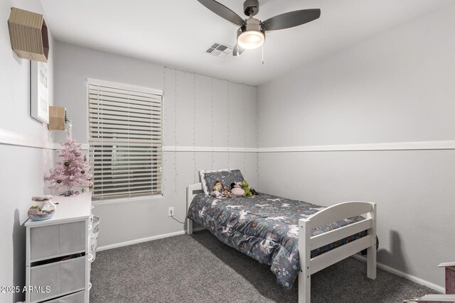 bedroom featuring dark carpet and ceiling fan