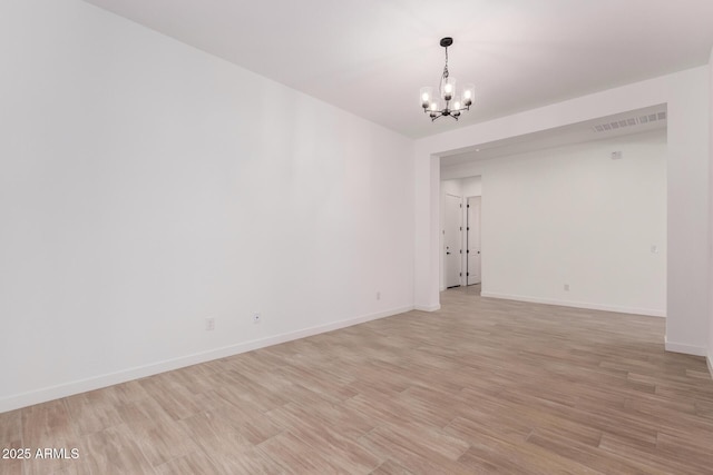 20273 W Monterey Way, Buckeye, AZ 85396 - unfurnished room featuring a chandelier and light wood finished floors