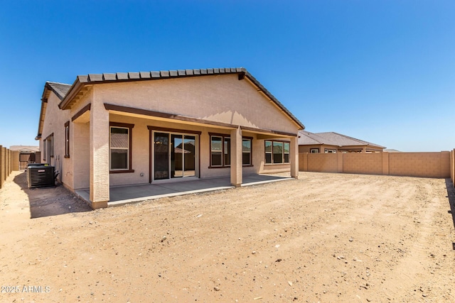 20273 W Monterey Way, Buckeye, AZ 85396 - back of house featuring a patio area, a fenced backyard, and stucco siding